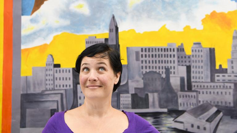 woman in front of mural