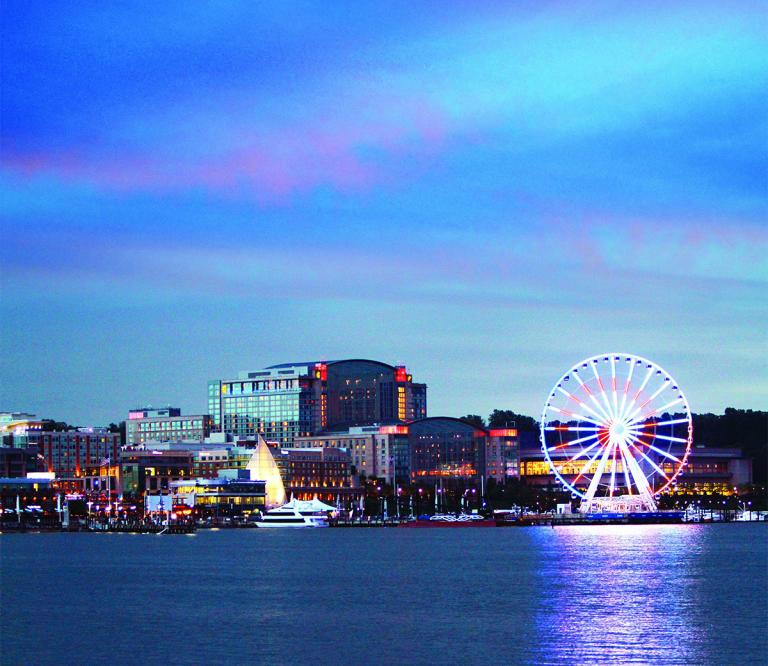 evening view of Gaylord National Resort and Capital Wheel from the water