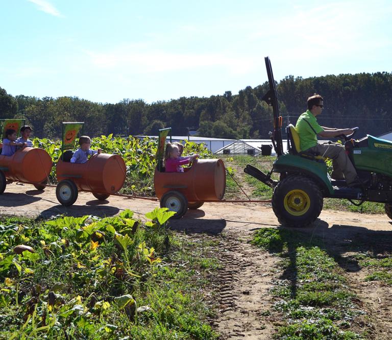 Children on the Pumpkin Express Ride at Homestead Gardens during Fall Fest