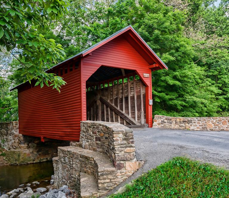 Hop on your bike and see authentic sites like this covered bridge in Frederick Countyy.