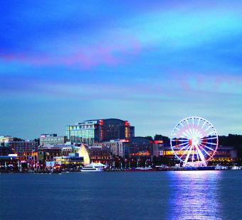 evening view of Gaylord National Resort and Capital Wheel from the water