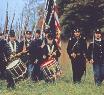 A photo of reenactment soldiers marching along the Antietam Civil War Trail