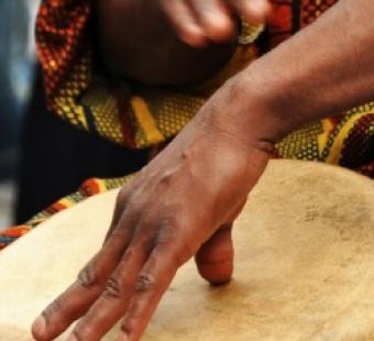 Hands drumming on a drum as a part of an African-American Heritage celebration