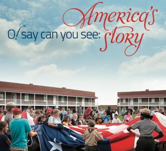 A view of visitors folding a large American flag at Fort McHenry