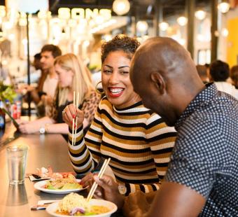 A couple enjoying eating together