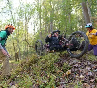 Hiker using adaptive hiking equipment