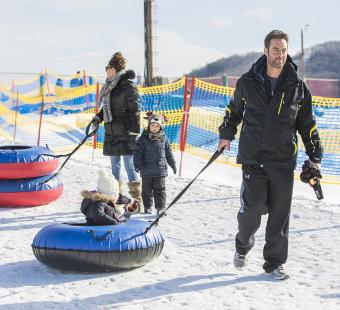 A family snow tubing together in Western Maryland.