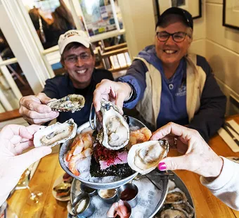 A family enjoying oysters