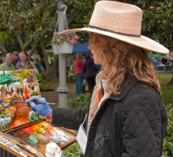 woman painting in a park