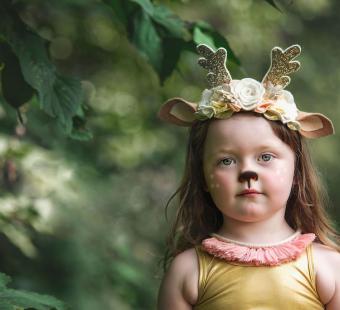 girl wearing woodland creature crown headband