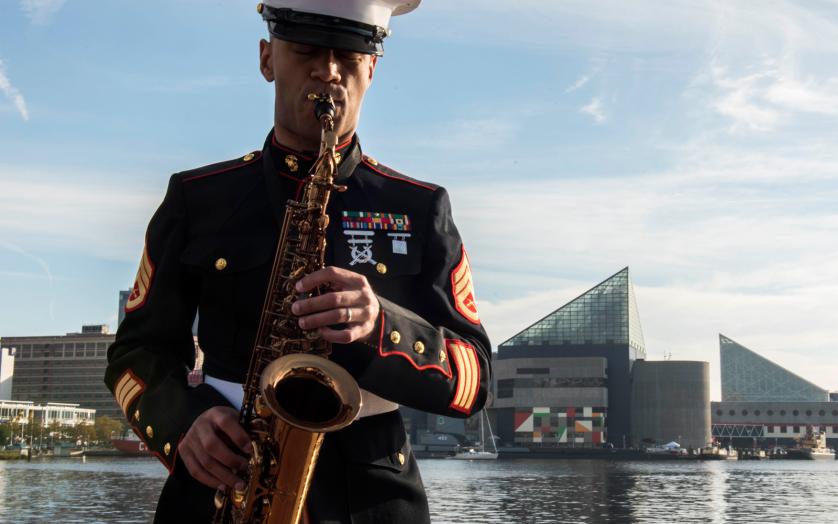 A United States Marine Corps Staff Sargent Playing a Saxophone in Baltimore Harbor