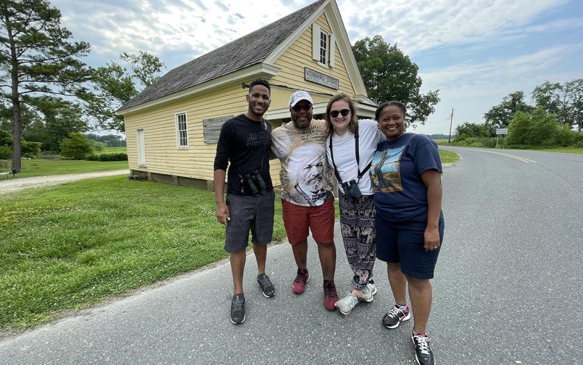 A group of people standing outside of the Bucktown Store along the Harriet Tubman Scenic Byway