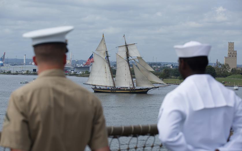Two men, one from the U.S Marine Corps and the other from the U.S Navy overlooking the Pride of Baltimore.