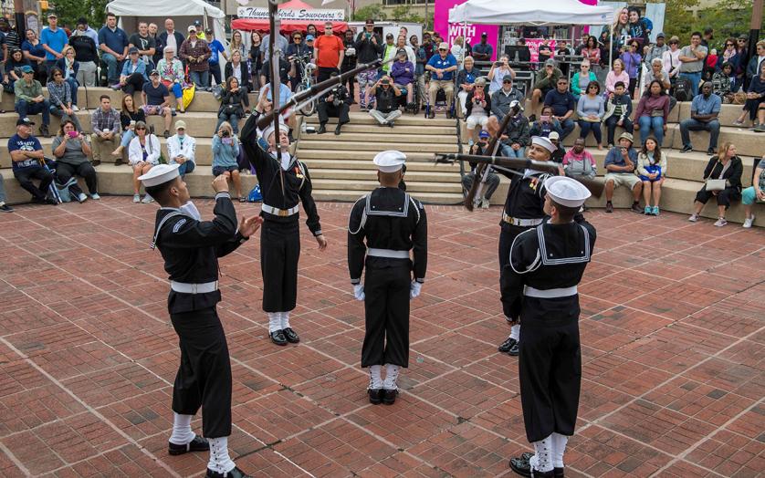 Navy men performing rifle drill team show