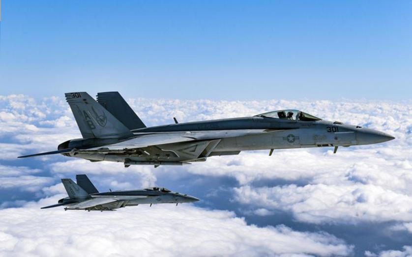 : F/A-18 Super Hornets from Strike Fighter Squadron (VFA) 136 "Knighthawks" fly in formation during a photo exercise.
