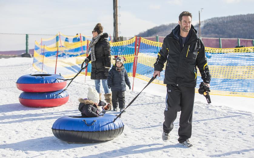 A family snow tubing together in Western Maryland.