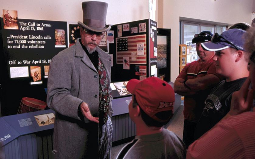 Reenactor speaking to students inside the Baltimore Civil War Museum