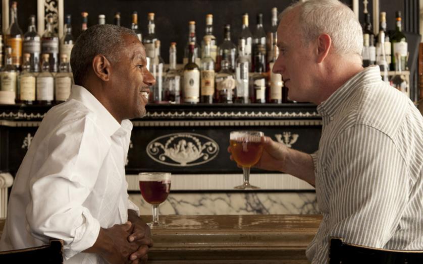 men drinking beer at bar