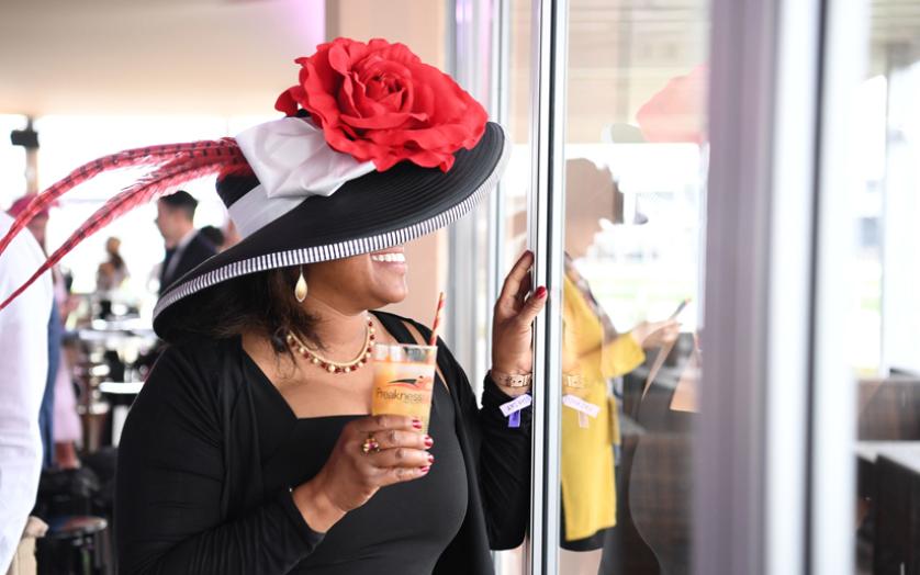 Enjoying a Black-Eyed Susan during the Preakness Stakes