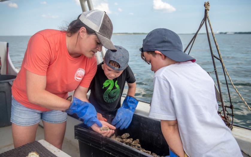 Visitors Inspect the Catch while on a Solomon's Island Heritage Tour
