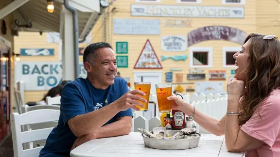 A couple enjoying a beer at the Boatyard
