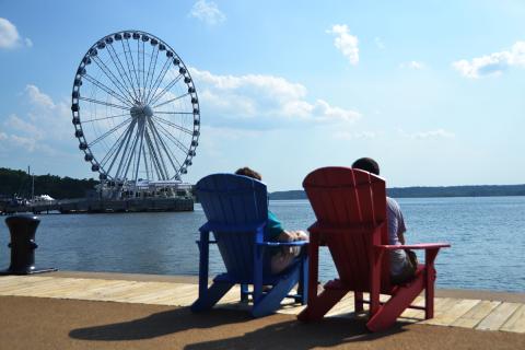 A couple relaxing and taking in the waterview at the National Harbor