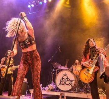 Lez Zeppelin performing on stage Photo
