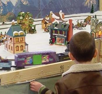 A young boy looks at the train exhibit at the SCIM Holiday Open House    Photo