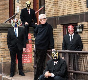 Nick Lowe & four people in Lucha Libre Mexican wrestling masks Photo