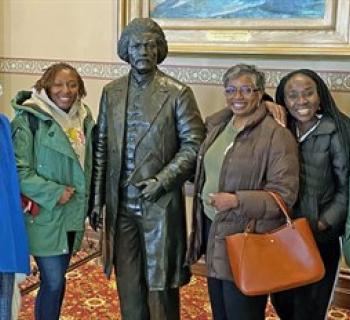 Watermark tour guides with group at the Maryland State House. Photo