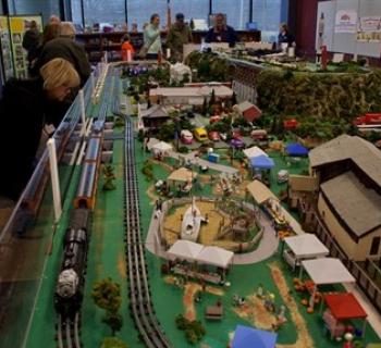Plane and Train Garden with hand modeled buildings and trains on three levels Photo