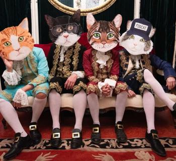 Four People Wearing Cat Head Costumes Photo