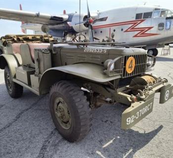 WWII 1944 Command Car and Fairchild  C123 in background just 2 of many on site Photo