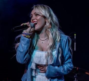 Cami Clune singing Photo