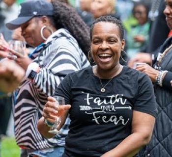 Happy Lady Enjoying Wine at Festival Photo