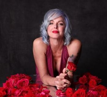Storm Large in a red dress Photo