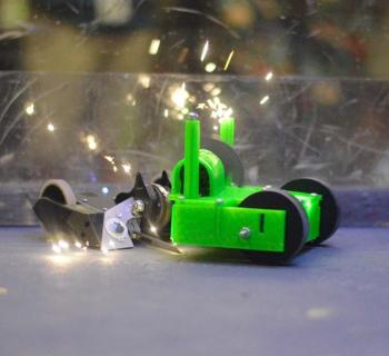 Sparks fly and competitors clash their robot creations to see who is the better driver and engineer Photo