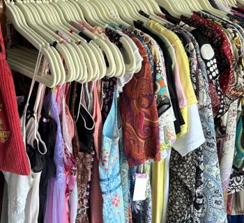 A rack of curated vintage clothing. Photo