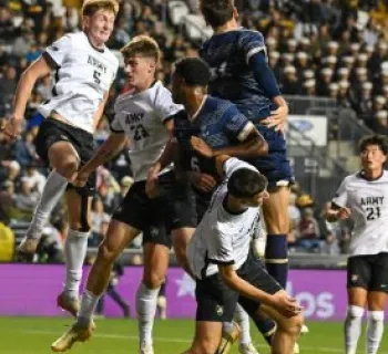 Players head butting a ball Photo