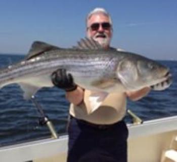 Man holding large fish Photo