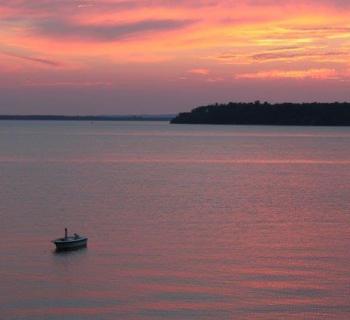 Crystal Beach at Sunset with small boat Photo