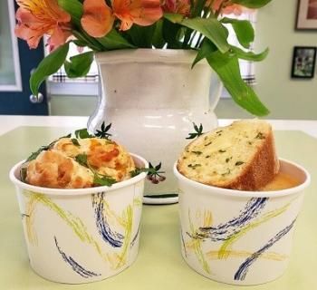 food on a table with a flower arrangement Photo