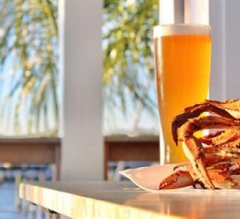 Enjoy delicious dishes, cocktails and views of Rock Hall Harbor at Admirals Club Beachside Bar. Photo