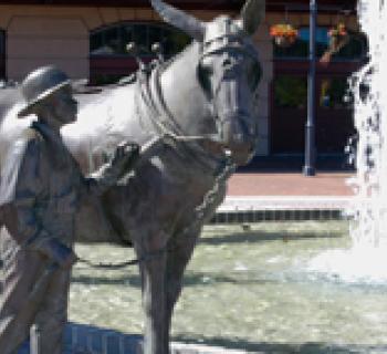 Statue of boy and donkey Photo