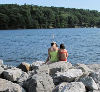 Mom and daughter by lake Photo