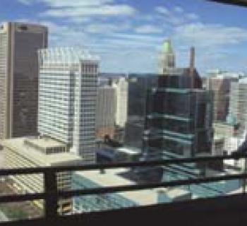 Man looking out window from observation level Photo