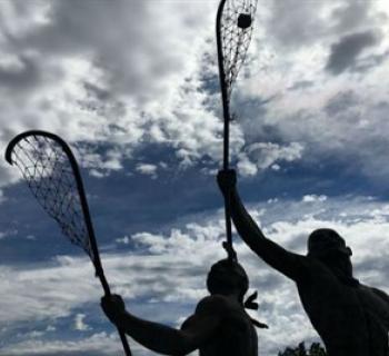 Statue of Native Americans playing LAX Photo