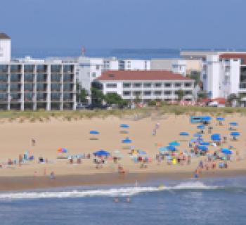 Beach view of the Castle In The Sand Hotel Photo