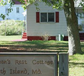 Fishermen's Rest Cottage with Sign Photo