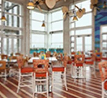 Interior of Blue Point Provision with large glass windows. Photo